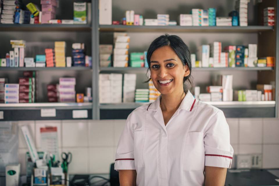 Pharmacist standing with smile